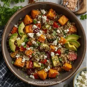 garlic herb roasted vegetable bowl with chickpeas quinoa and tahini drizzle