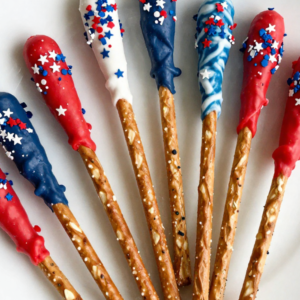 4th of July pretzel rods dipped in red white and blue candy melts with star sprinkles