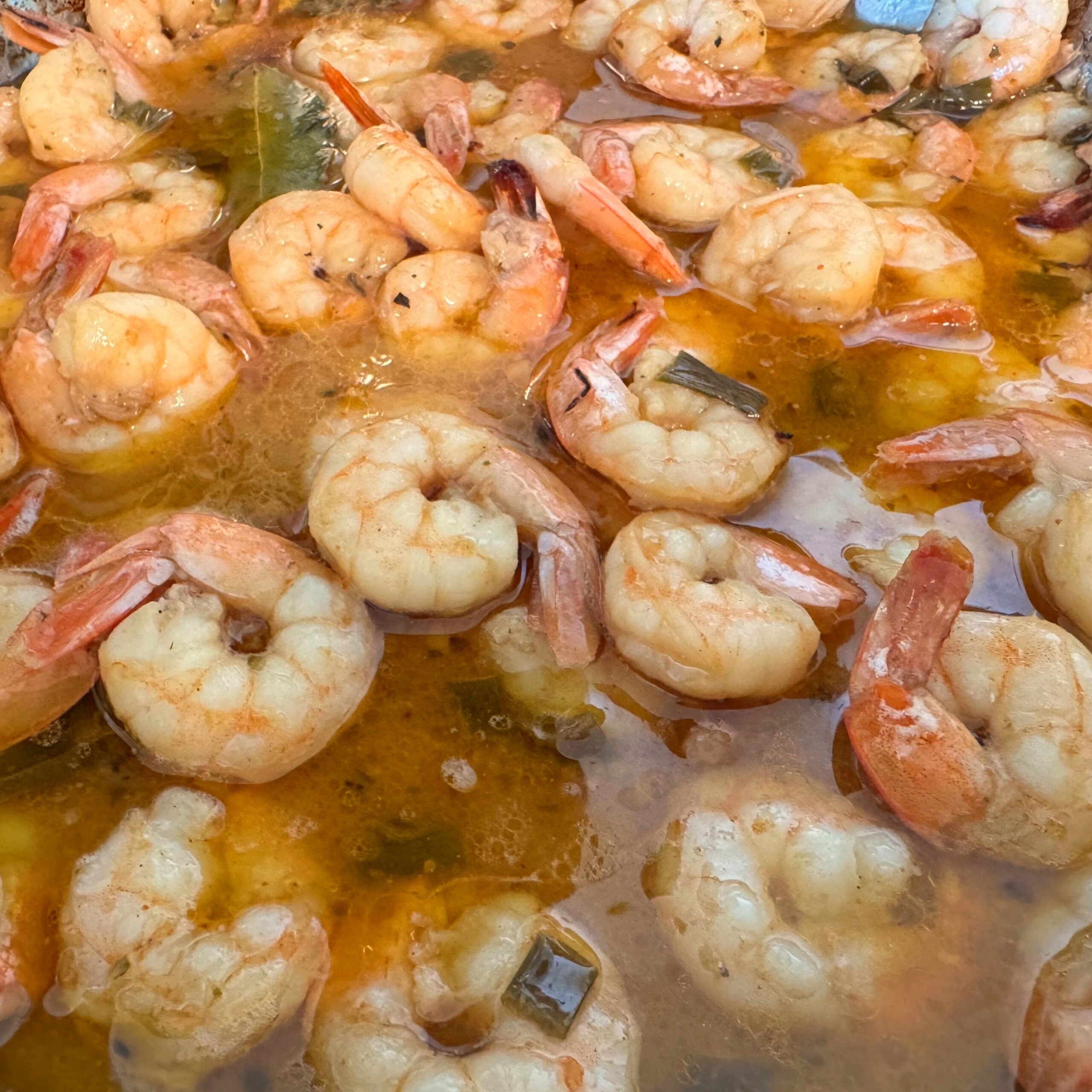 louisiana bbq shrimp in pan in sauce